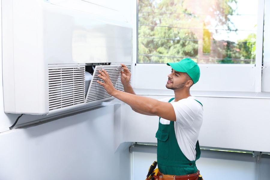 air conditioning repair technician working inside 2026 03 27 02 27 01 utc