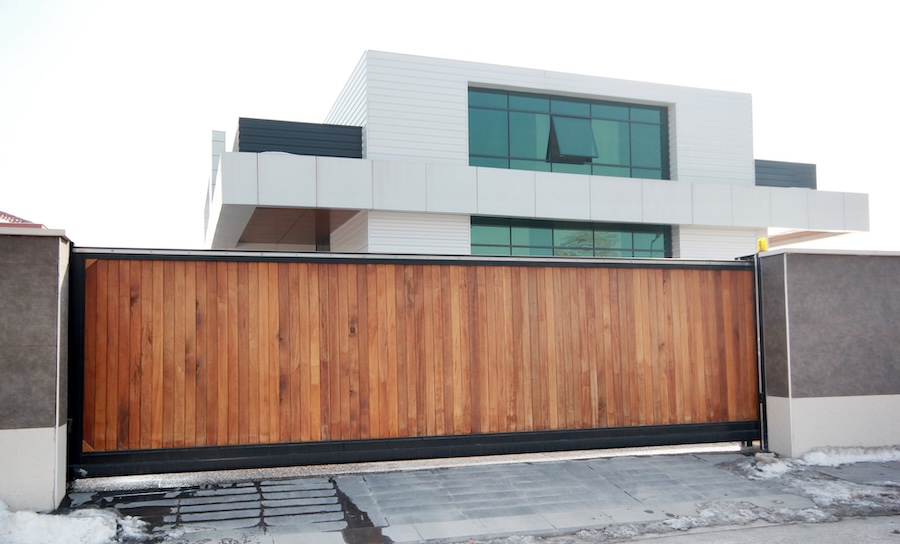 modern house facade behind wooden security gate 2026 01 06 10 27 23 utc