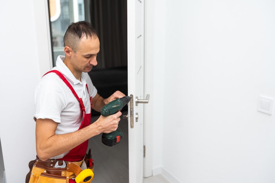 professional repairman fixing door lock with cordl 2026 01 07 00 20 32 utc